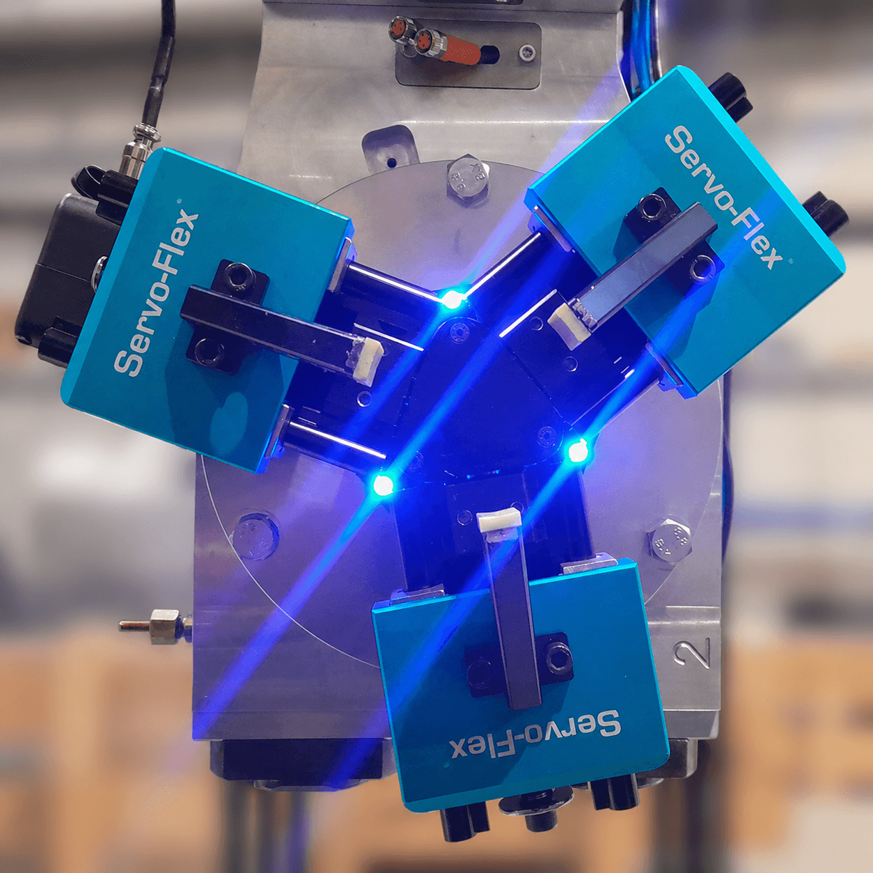 Servo-Flex Flexi 150 three-jaw servo-electric robot gripper with blue safety LEDs